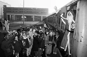 Kids Prints: Father Christmas arriving at Snow Hill station yesterday being greeted by enthusiastic