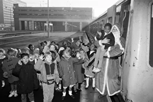 00706 Prints: Father Christmas arriving at Snow Hill station yesterday being greeted by enthusiastic