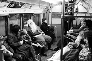 Father Christmas, of Bentalls Store, Ealing, takes the tube to pick up his sleigh