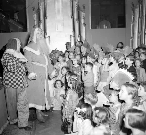 Clown Prints: Father Christmas and his clown sidekick address the children at the yearly Daily Mirror