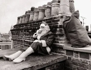Father Christmas December 1986 Santa sinks a well earned pint as he waits for a