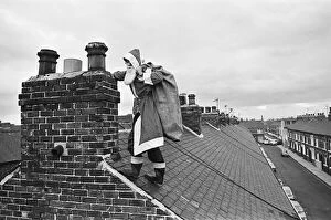 01366 Collection: Father Christmas on rooftops, in Middlesbrough. Circa 195