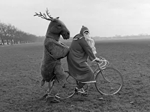 00204 Prints: Father Christmas and his Rudolf the Reindeer - bike stunt A©Mirrorpix circa 1980