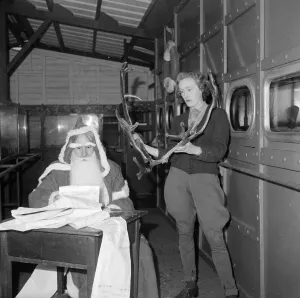 List Prints: Father Christmas seen here at London Zoo with a pair of reindeer antlers