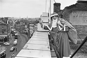 Sack Prints: Father Christmas seen here on the roof of Wellsteed department store in Broad Street