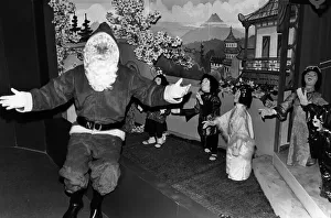 Dolls Prints: Father Christmas at the T J Hughes Christmas grotto in Liverpool. 11th November 1989