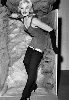 Stockings Prints: Felicity Frosdick as Miss Scandale'arrives in her box wearing a new garment