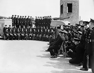 Firefighters Prints: Female firefighters pose with their commandant for a photograph before leaving their