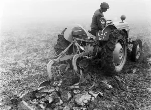 Agriculture Prints: A Ferguson TE20 tractor seen here ploughing a Warwickshire field circa 1953