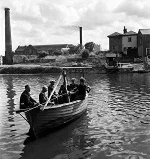 Ferry boy Keith Pollard operating the boat across the River Exe. June 1952 C3127