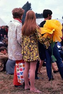 Festival of the Flower Children Hippy hippies with giant large yellow flower