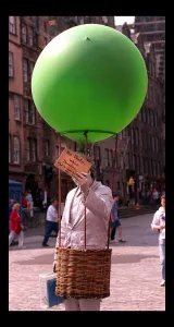 Some of the festival goers in edinburgh August 1998 Man holding green balloon