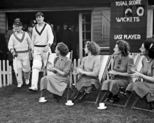 Festive game of cricket. J. Lawrence and Bill Sutcliffe take to the field at Collingham