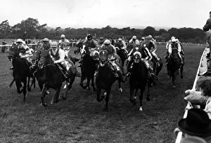 The field approach the mile post, with the eventual Derby winner Crepello 1957
