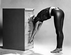 Keep Fit Prints: Filing Cabinet: Remove shoes. Face cabinet with arms outstretched