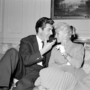 Square Prints: Film actress Ginger Rogers with David Hughes sitting on a couch together May
