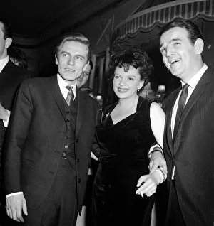 Film actress Judy Garland with pop singer Adam Faith (left