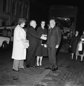 Film Director Alfred Hitchcock saying goodbye to Grace Kelly
