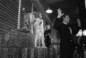 Film Goldfinger 1964 Sean Connery as James Bond 007 poses with Bond girls Honor Blackman