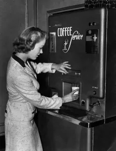 Film star Patricia Dainton selecting the exact amount of milk and sugar she requires