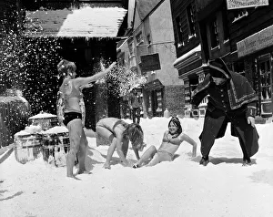 Filming of Oliver! at Shepperton studios. Three girls having a snowball fight with Harry