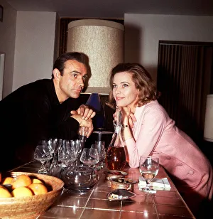 Films Gold Finger 1964 Sean Connery as James Bond leans on breakfast counter with Honor