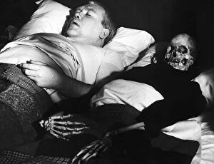 Skeleton Collection: Films Under Milk Wood starring in a scene is actor Ray Smith with his skeleton wife in