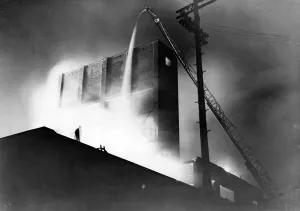01435 Prints: Fire at Adam Street, Cardiff, following an air raid attack. Circa 1941