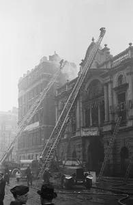 Firefighters Prints: Fire crews, police and ARP wardens help salvage furniture from properties close to