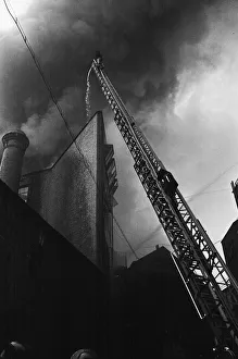 Smoke Prints: Fire fighters and emergency workers fight a fire at Brown Brothers, Great Eastern Street