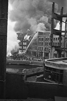 01487 Prints: Fire fighters and emergency workers fight a fire at Brown Brothers, Great Eastern Street