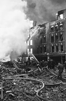 01487 Prints: Fire fighters and emergency workers fight a fire at Brown Brothers, Great Eastern Street