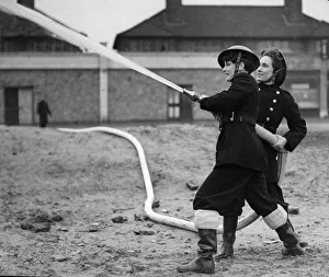 Spray Prints: Fire women of the National Fire Service using a hose during training exercises inn