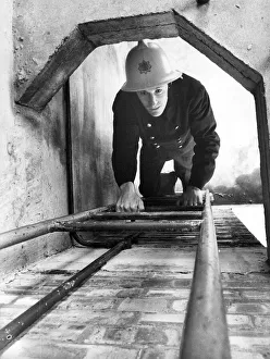 00074 Prints: A firefighter climbs the ladder at the Morpeth drill tower where Northumberland