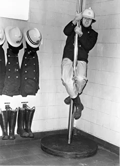 Firefighter Prints: Firefighter Geoff Kelly slides down the pole at Consett Fire Station