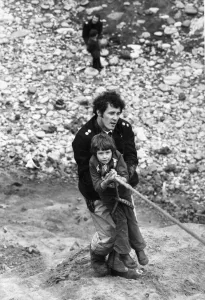 Firefighter Jeff Kipling helps as seven-year old Peter Harrison is hauled up the Ryhope