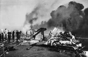 01445 Prints: Firefighters busy on board HMS Formidable after a Japanese suicide plane had crashed
