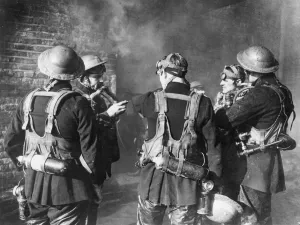 00073 Prints: Firefighters check their breathing apparatus and gas masks before moving into a burning