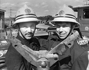 Firefighter Prints: Firefighters Chris Foster and John Burke show off the new vehicle cutting equipment