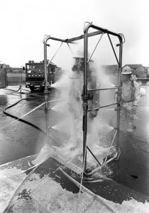 00072 Prints: Firefighters are decontaminated after dealing with the chemical spillage at the scene