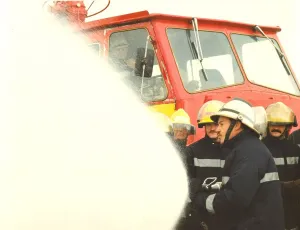 Firefighters practice rescue routines in a training exercise on the river