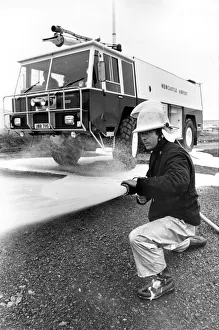 Fireman Bob Ford with the new fire engine at Newcastle Airport
