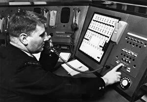 Firemen Collection: Fireman demonstrates new electronic private circuit system installed in Control Room at