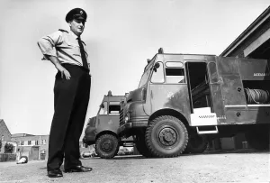 00072 Prints: Fireman Jim Cairns with two of the fire appliances brought out of storage to help fight