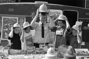 00668 Prints: Fireman Paddy Flaherty made sure these youngsters had the right hat of the occasion when