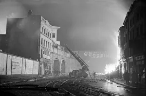 Hose Prints: Fireman tackle a blaze in the Waterloo area cause by High Explosive bombs during the 2nd