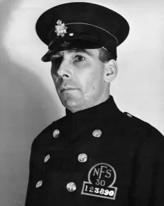 A fireman wearing the new National Fire Service cap and breast badge