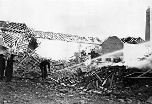 01434 Prints: Firemen on a building site during the recent raid on a South Wales town. Circa 1941