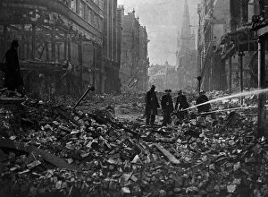 Rubble Collection: Firemen dampen down fires in Wine Street, Bristol which was devastated by high explosive