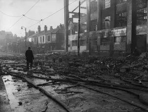 Firemen dampening down the burnt out shell of the Dobson & Crowther factory, Aston Road